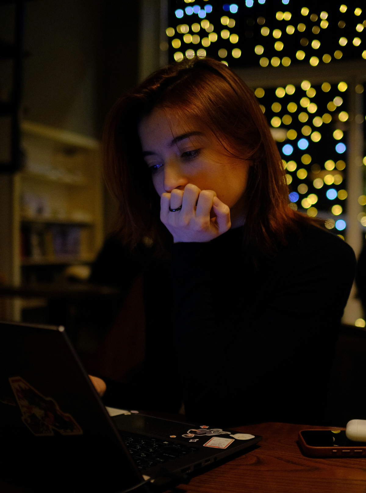 Woman at computer from behind